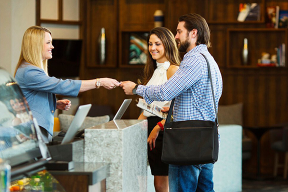 People checking in at hotel People checking in at hotel