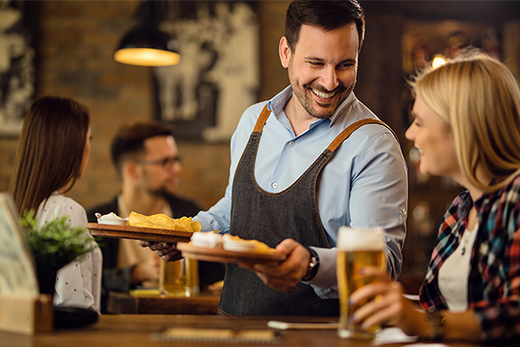 Woman being served at a restaurant Woman being served at a restaurant